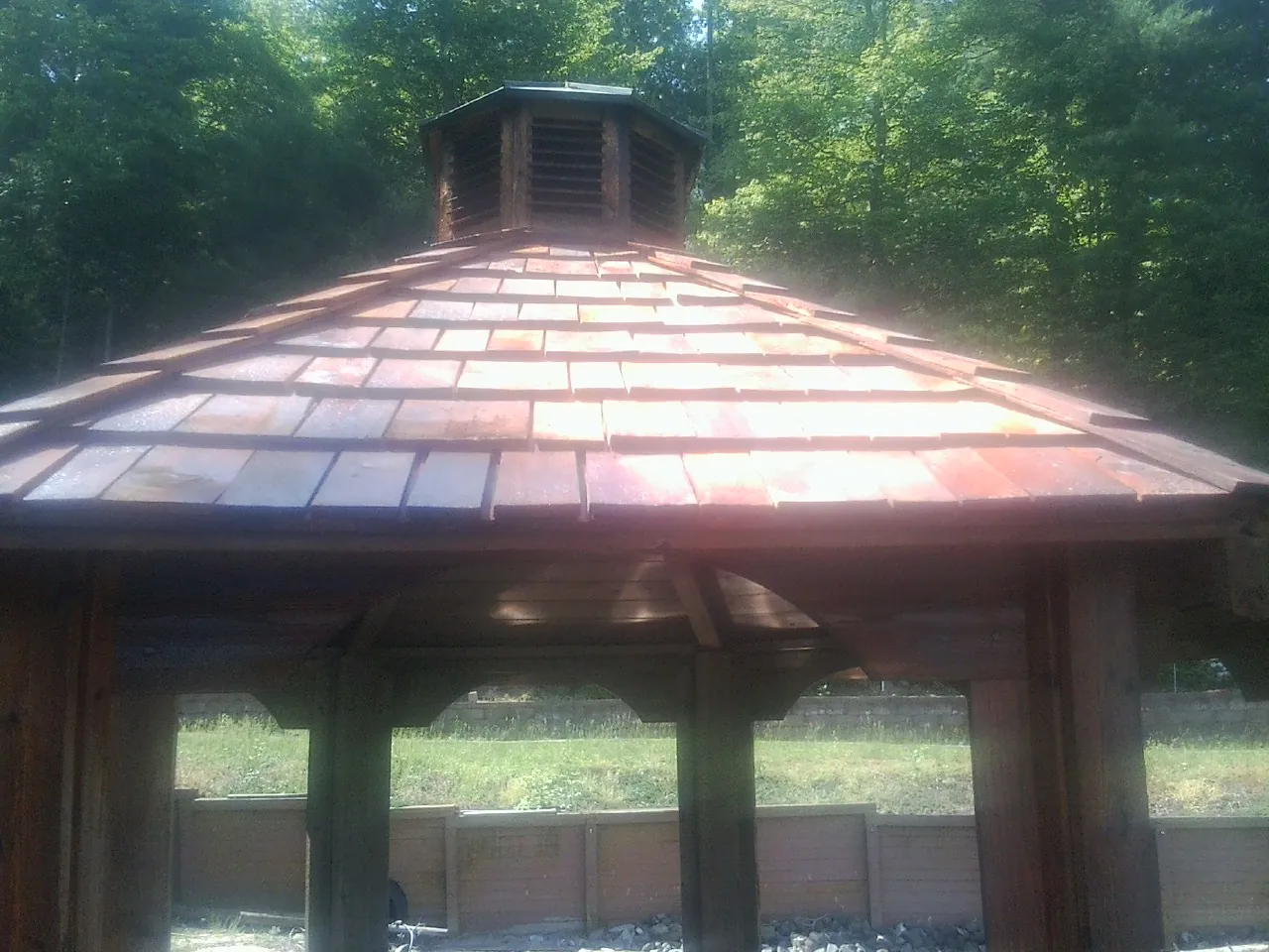 New cedar shake roof and cupola on a lakeside gazebo in Georgetown